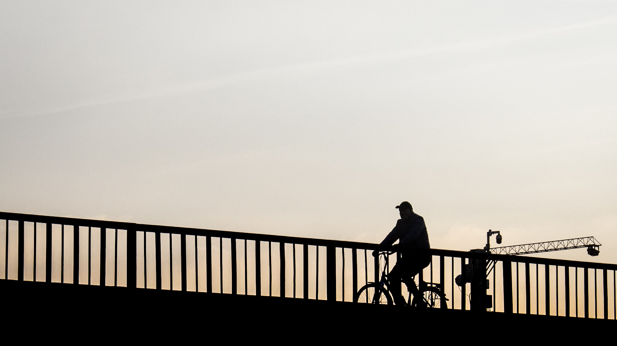 Photographer silhouette on bridge